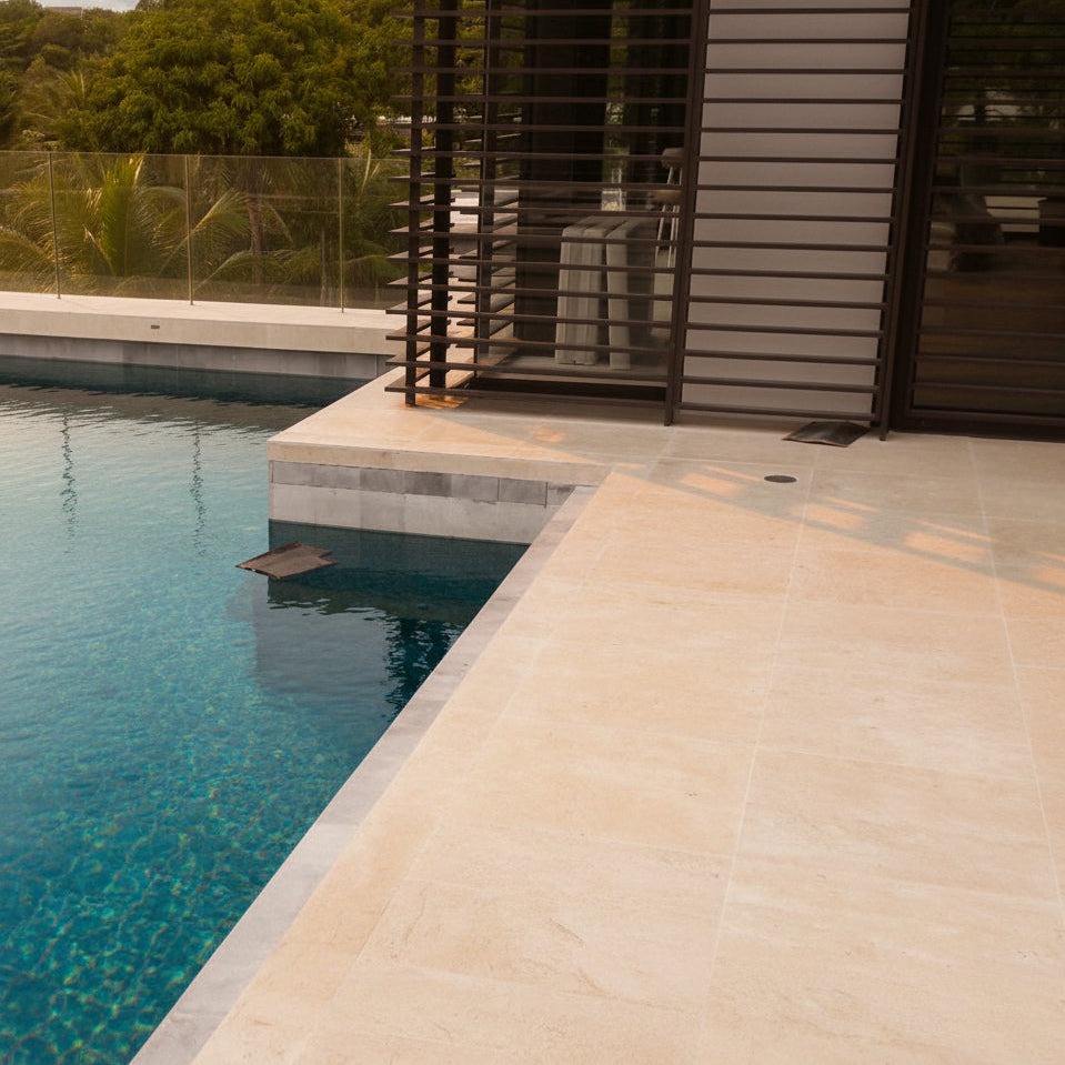Cream white marble floor tiles with plain pattern, around pool walk ways, natural stone flooring Thailand